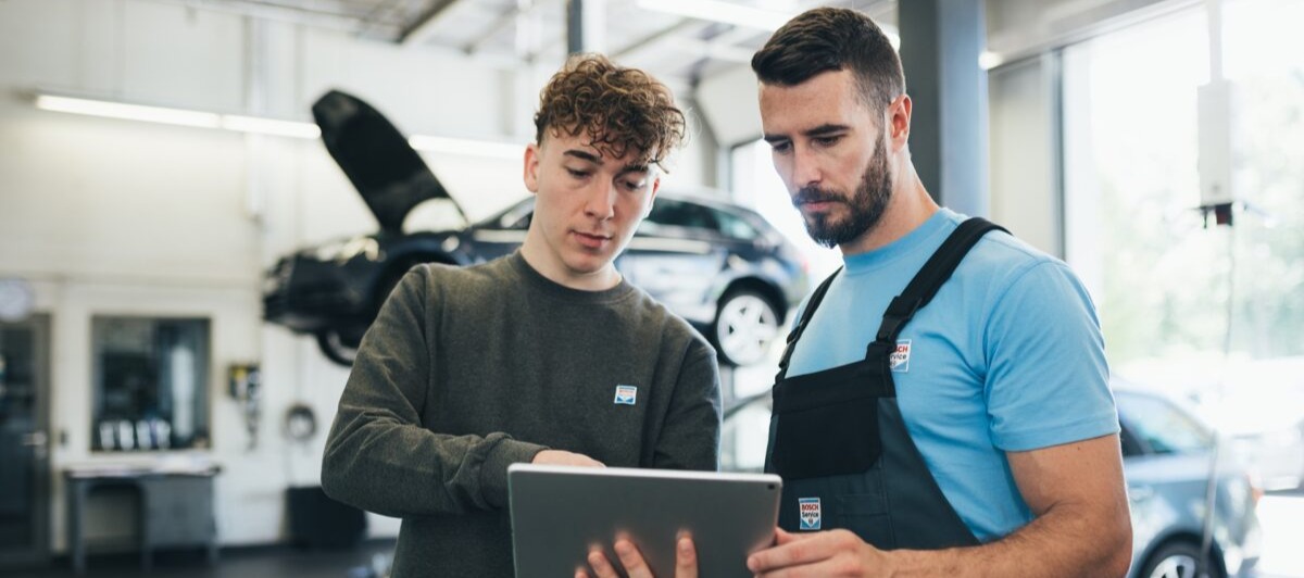 Bosch Car Service Technicians reviewing vehicle data